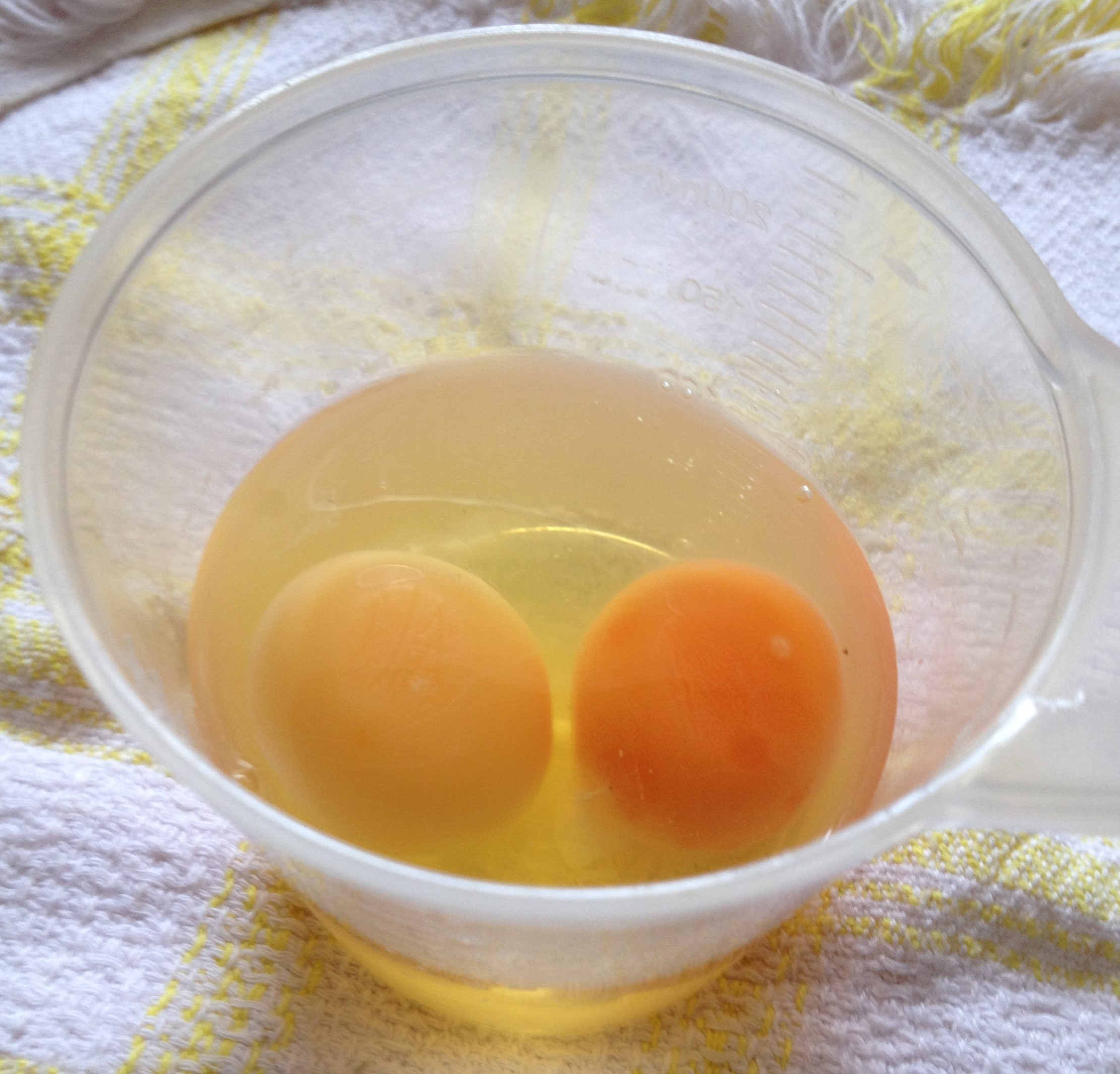 cracked eggs in a jug
