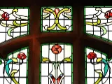 Red and green flower motif stained glass window in North Shore Methodist Church